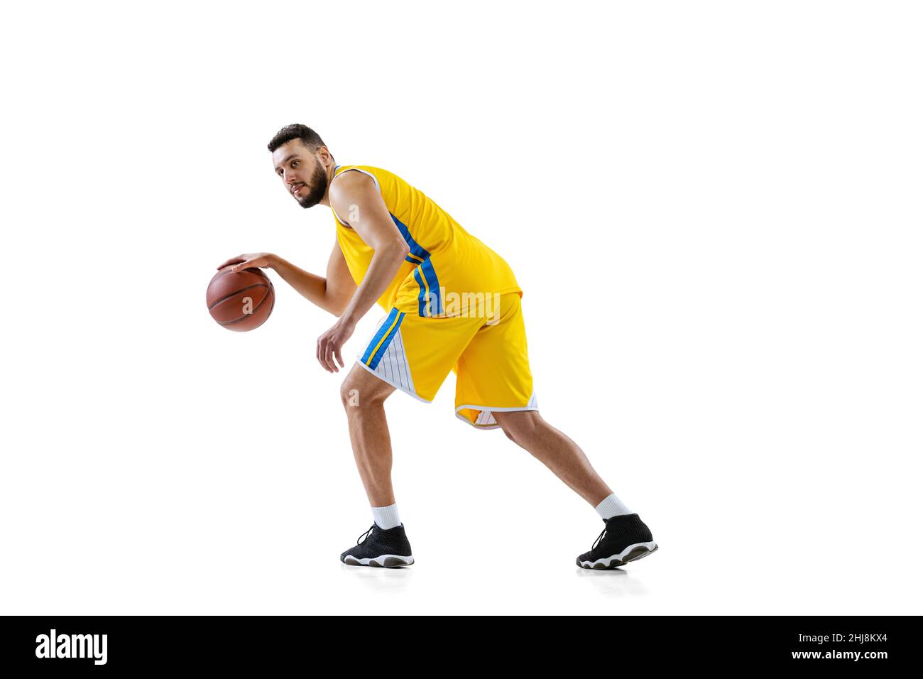 Full length portrait of professional basketball player training