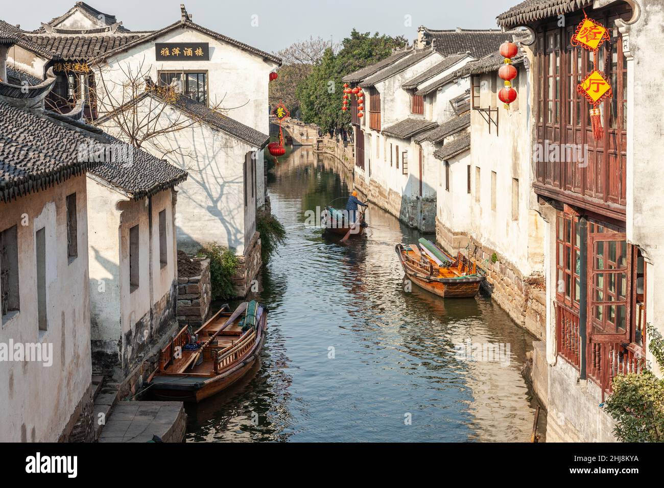 View of a canal with water taxis in the water town of Zhouzhuang, China Stock Photo