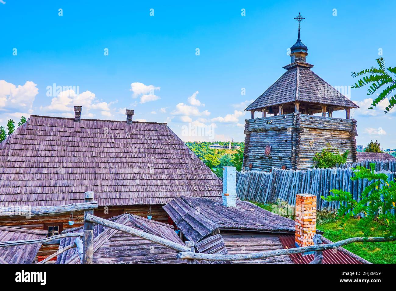 Panorama of the wooden roofs, palisade, towers and yards of the Small Kish (trade and craft settlement) of Zaporizhian Sich scansen, Khortytsia Island Stock Photo