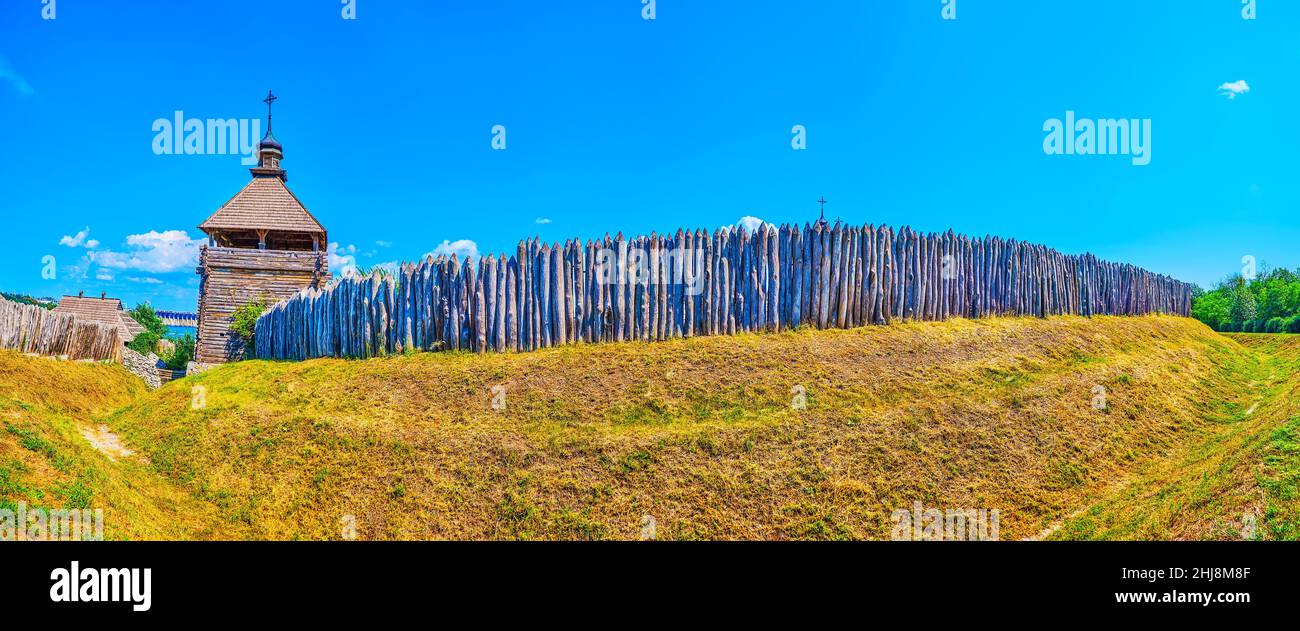 Panorama of reconstructed timber Zaporizhian Sich Fort scansen with tall stakewall (palisade), towers and the dug moat, Zaporizhzhia, Ukraine Stock Photo