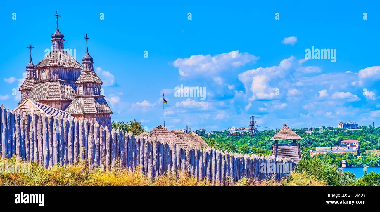 The domes of wooden Church of the Intercession and stockade of  Zaporizhian Sich Fort scansen in Zaporizhzhia, Ukraine Stock Photo