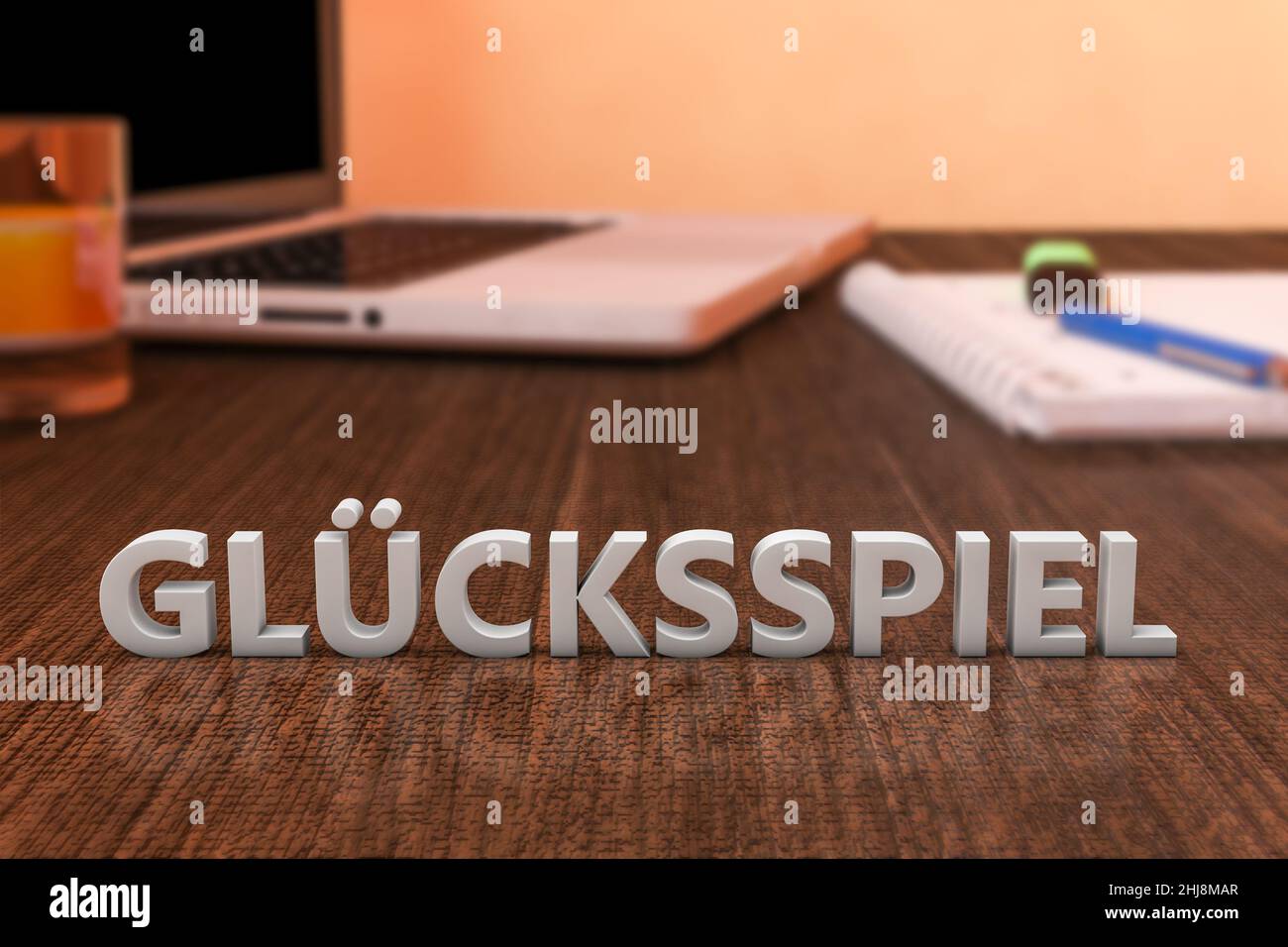 Gluecksspiel - german word for gambling or game of chance - letters on wooden desk with laptop computer and a notebook. 3d render illustration. Stock Photo