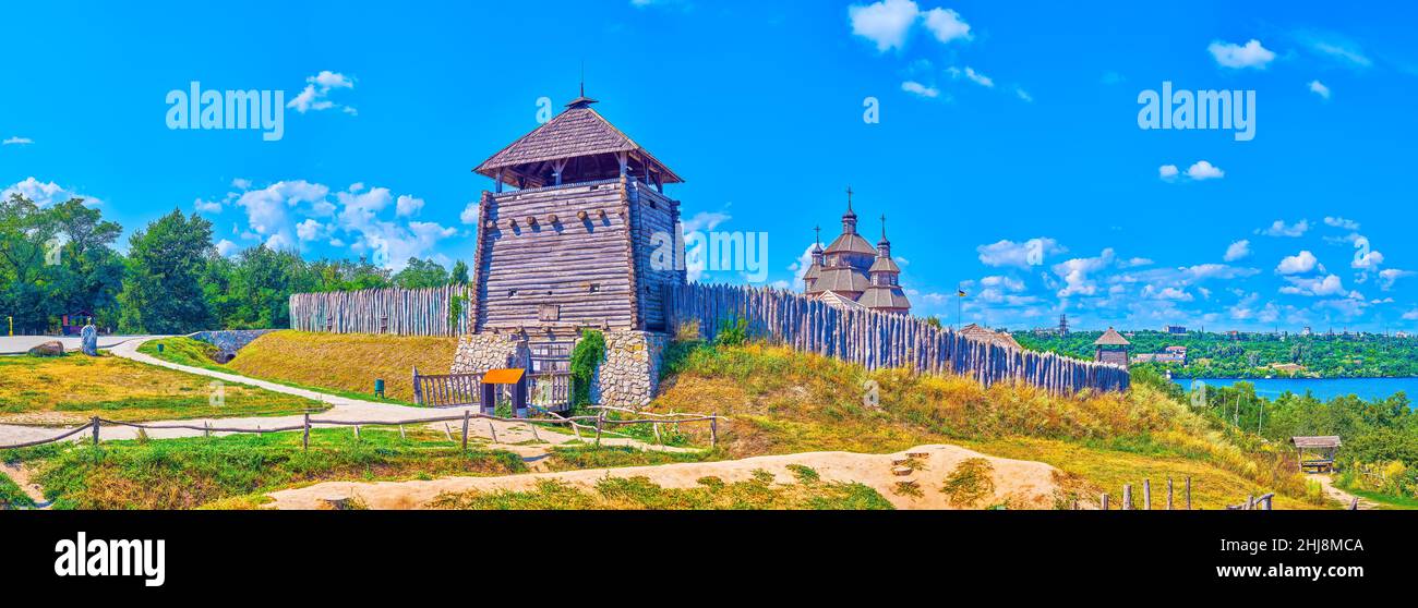 Panorama of Zaporizhian Sich Fort scansen with tall stakewall (palisade), towers, St Nicholas Church, dug moat, hills, Dnieper River from the Khortyts Stock Photo