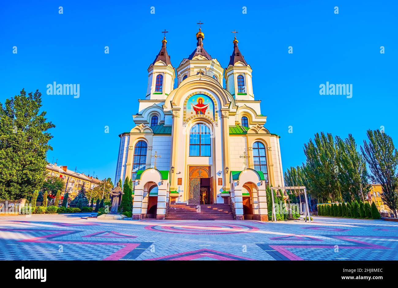 Facade of the Holy Pokrovsky Bishop's Cathedral with scenic pavement of the courtyard,  Zaporizhzhia, Ukraine Stock Photo