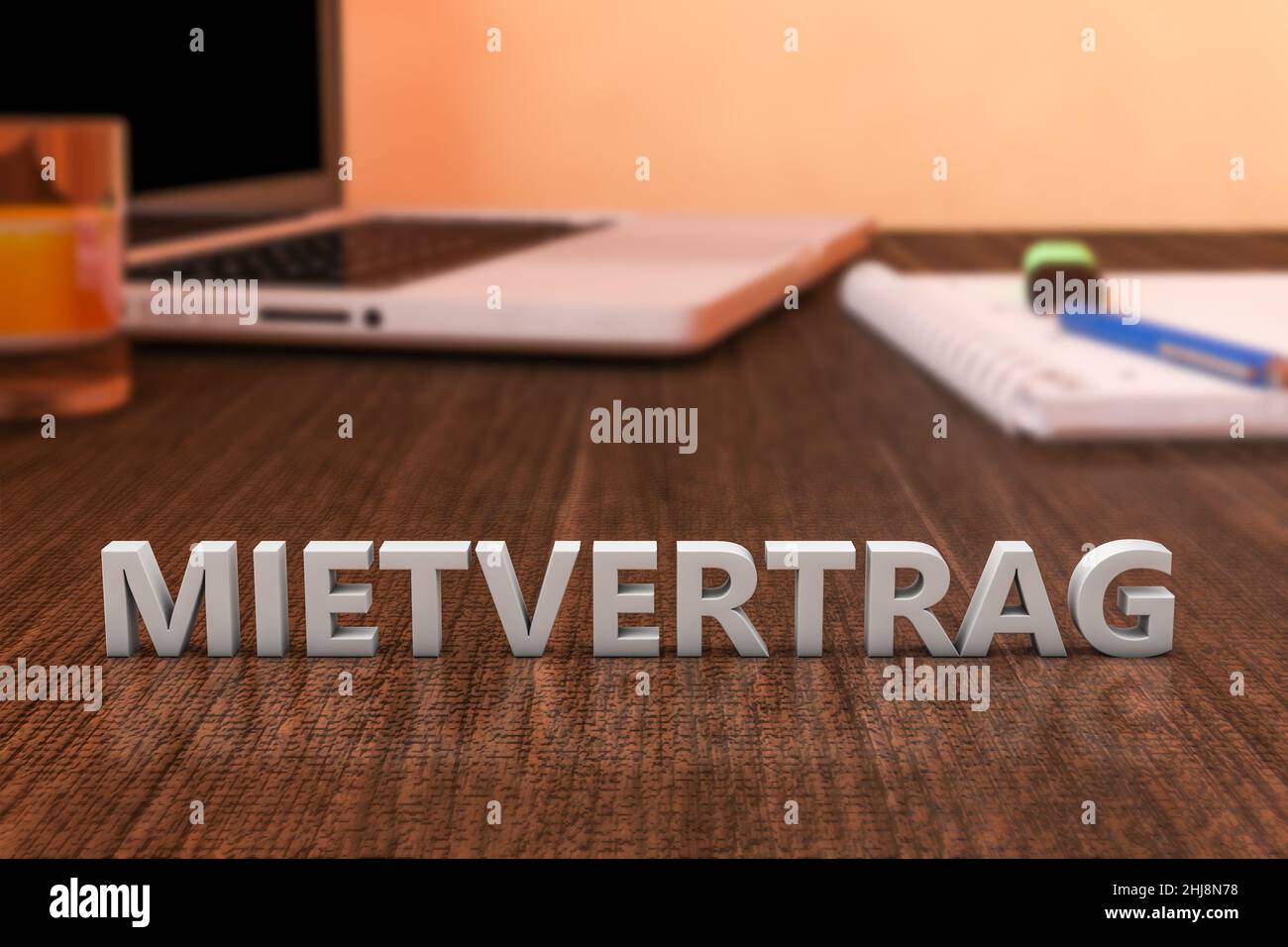 Mietvertrag - german word for rent contract or lease agreement - letters on wooden desk with laptop computer and a notebook. 3d render illustration. Stock Photo