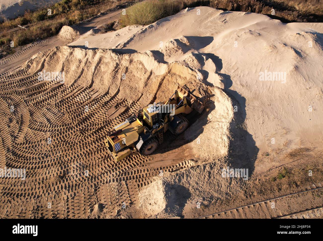 Frontend loader during digging and excavation operations in open pit