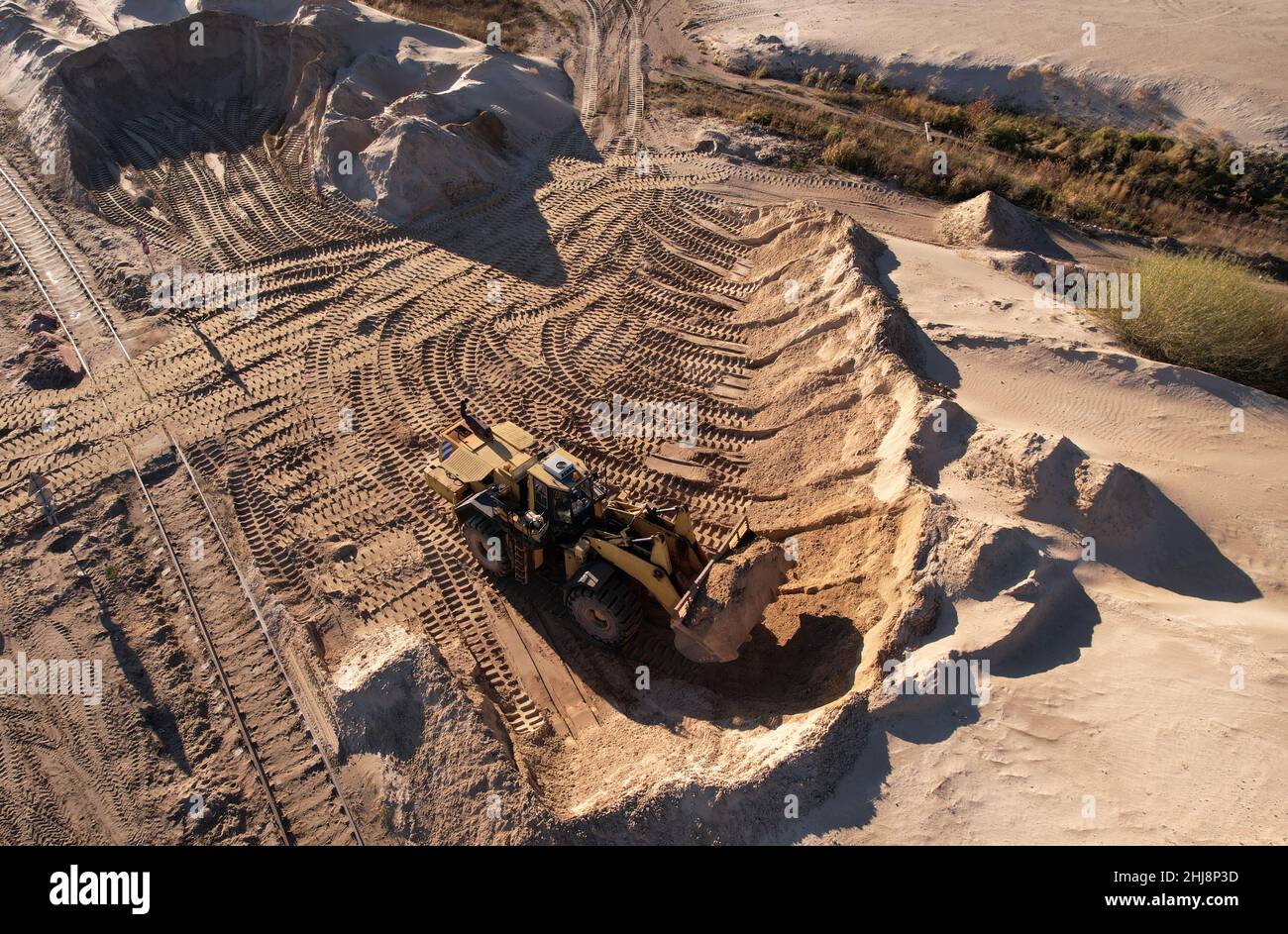 Frontend loader during digging and excavation operations in open pit