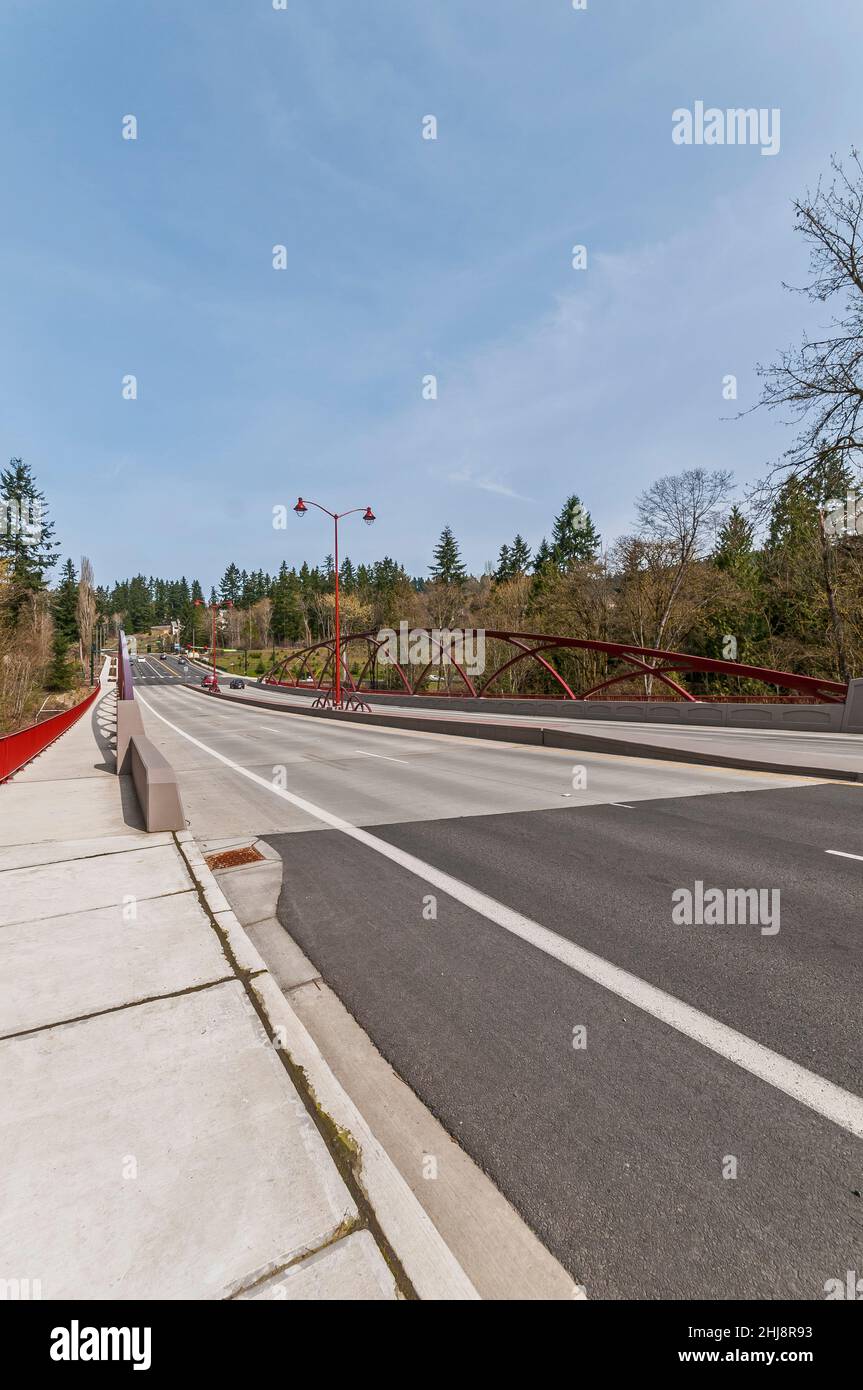 The sidewalk and the artistic arches showing how they are secured to the concrete barriers on the May Creek Bridge in Newcastle, Washington. Stock Photo