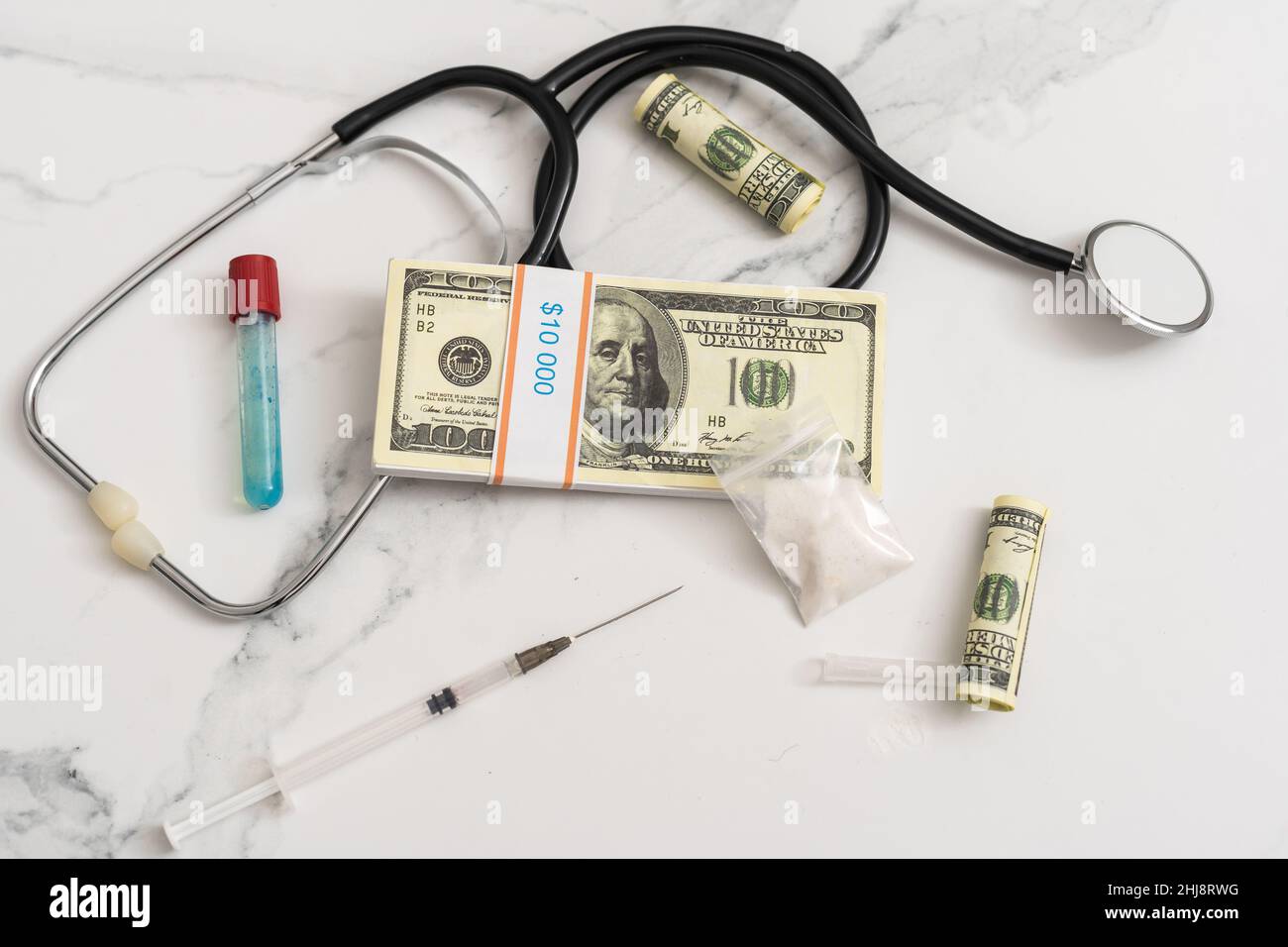 high costs of expensive medication concept , money and stethoscope