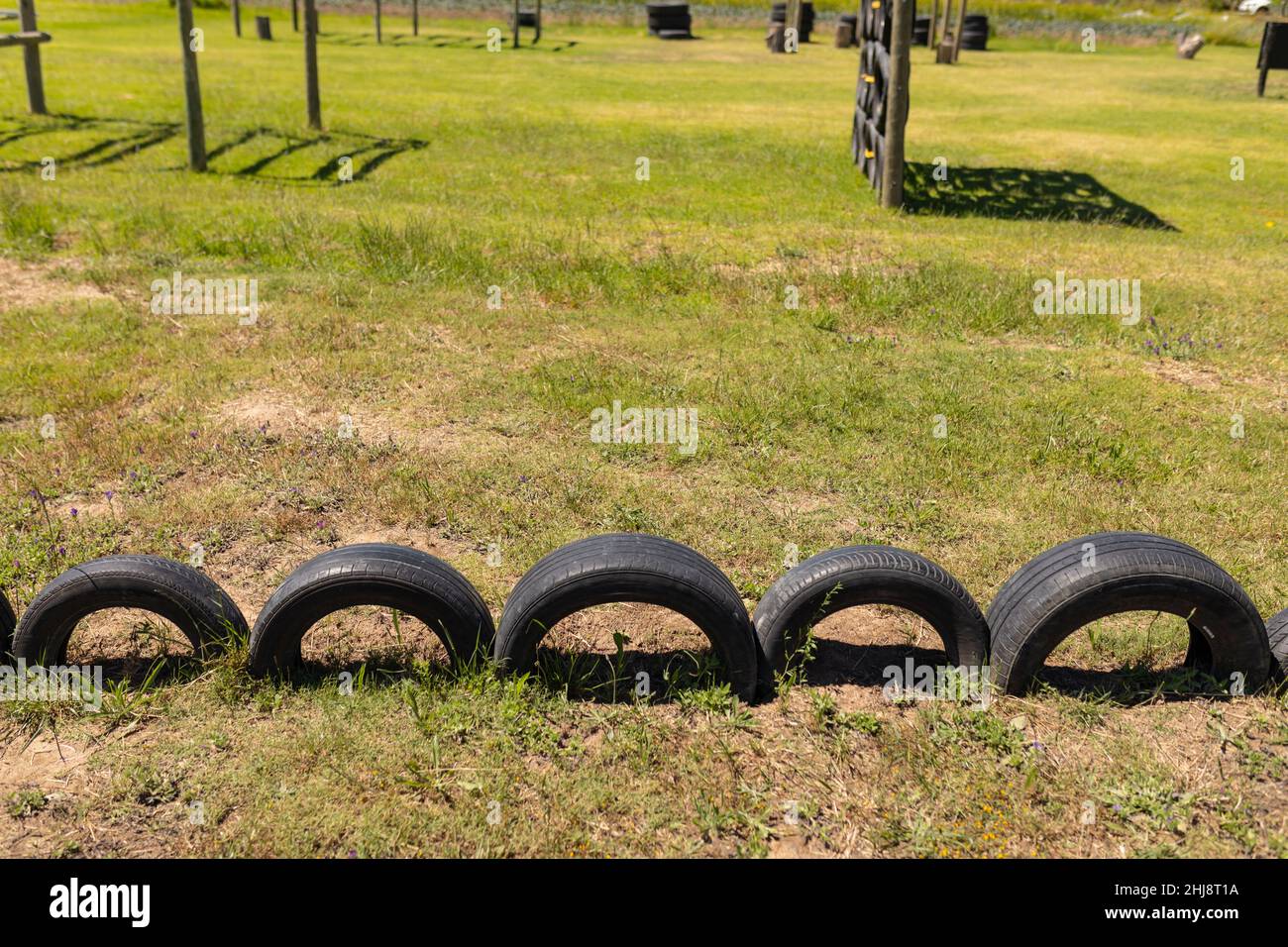 View of tire obstacle course on the grass at boot camp Stock Photo