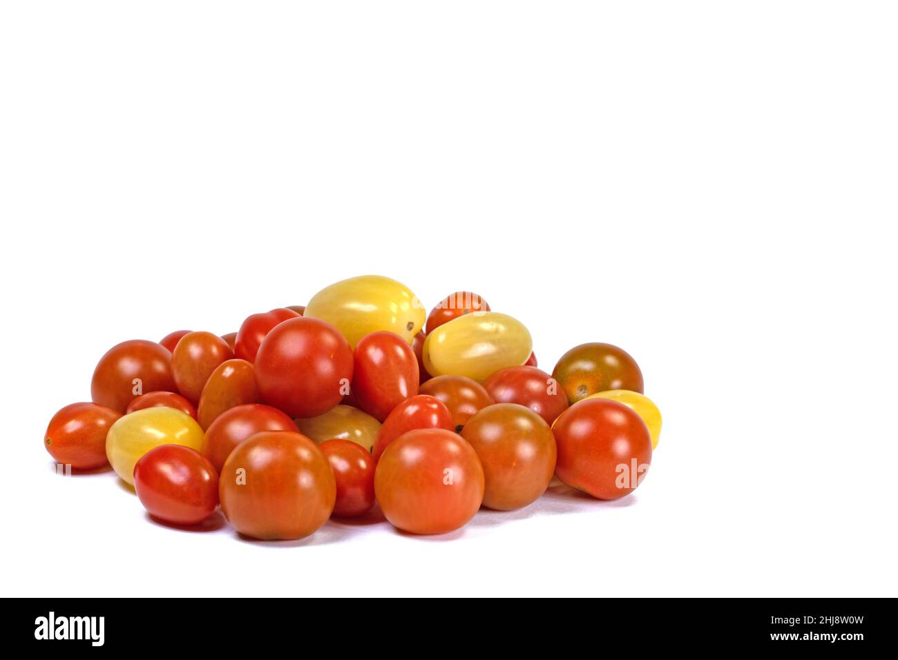 Various mini tomatoes against a white background Stock Photo