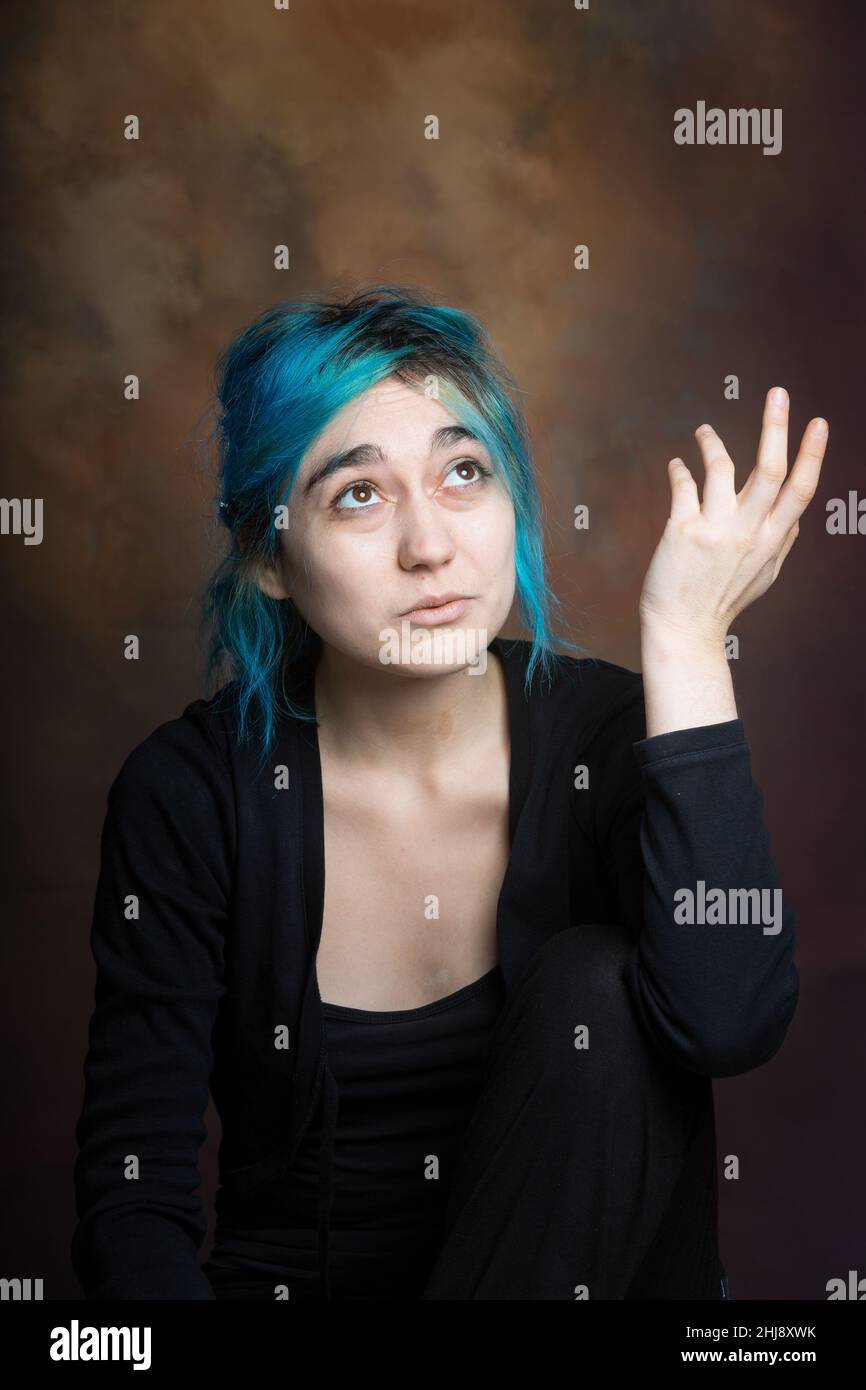 photo of young woman expressing melancholy, sadness, reflection Stock Photo