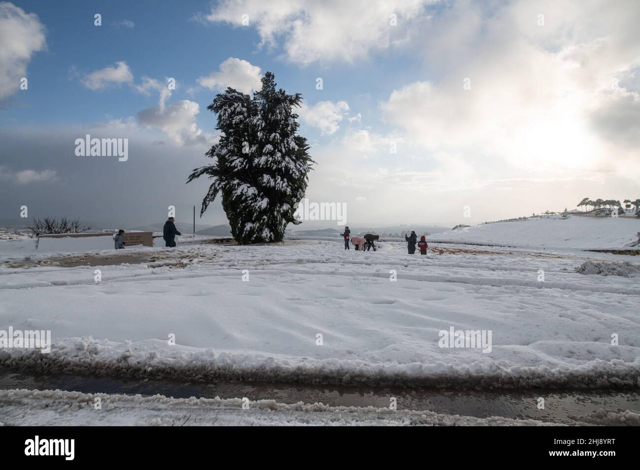 Israeli and Palestinian Families play in the snow on Mount Scopus. Jerusalem, Israel. Jan 27th 2022. ( Credit: Matan Golan/Alamy Live News Stock Photo