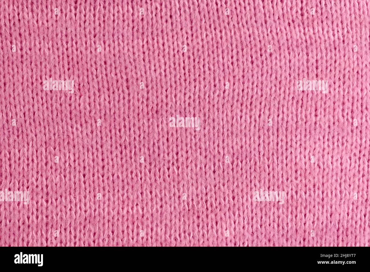 Soft pink woolen knitted textured cloth background mockup, copy space Stock Photo