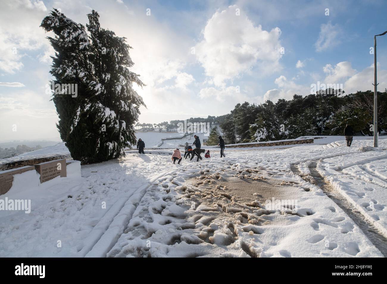 Israeli and Palestinian Families play in the snow on Mount Scopus. Jerusalem, Israel. Jan 27th 2022. ( Credit: Matan Golan/Alamy Live News Stock Photo