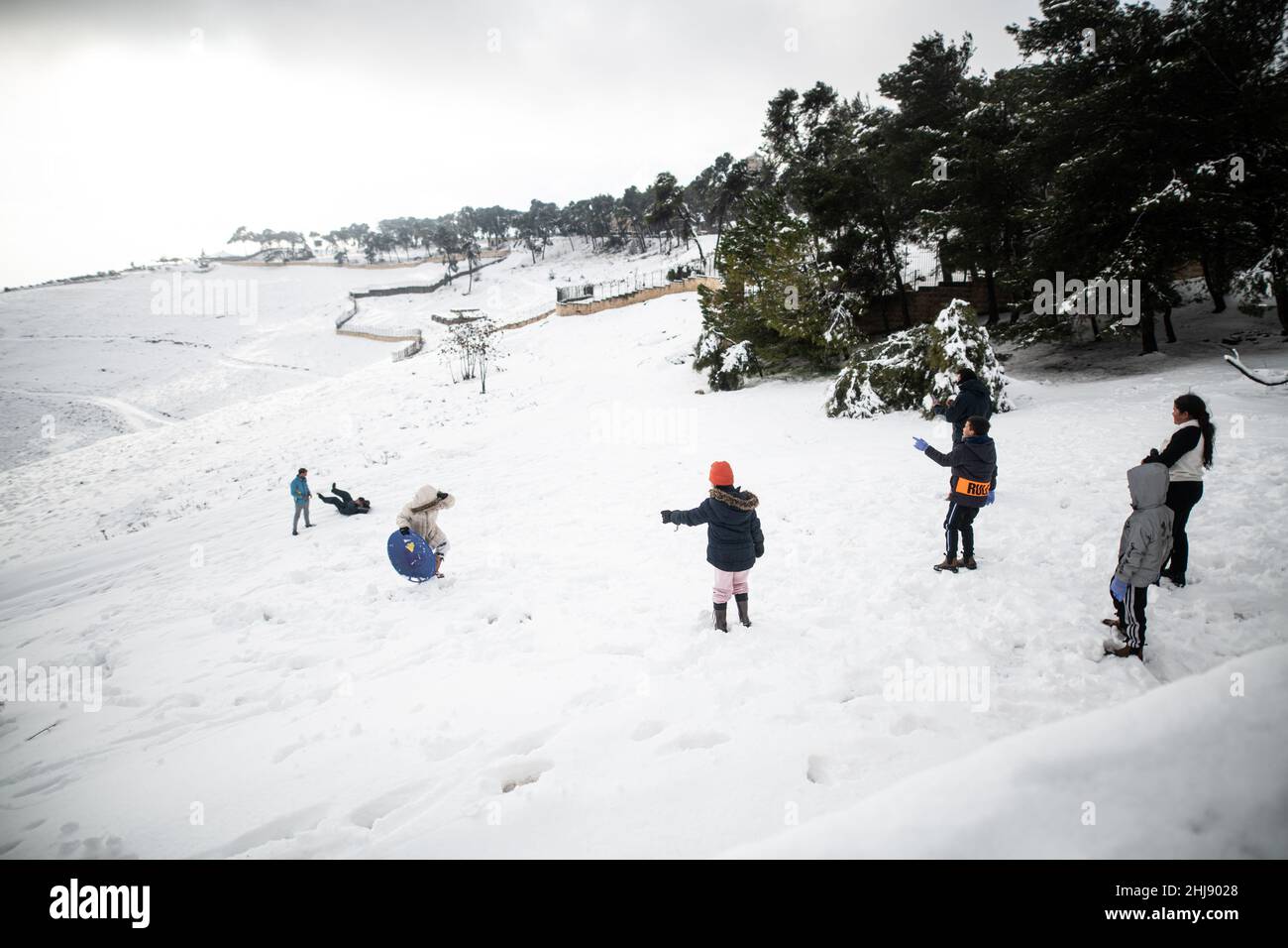 Israeli and Palestinian Families play in the snow on Mount Scopus. Jerusalem, Israel. Jan 27th 2022. ( Credit: Matan Golan/Alamy Live News Stock Photo