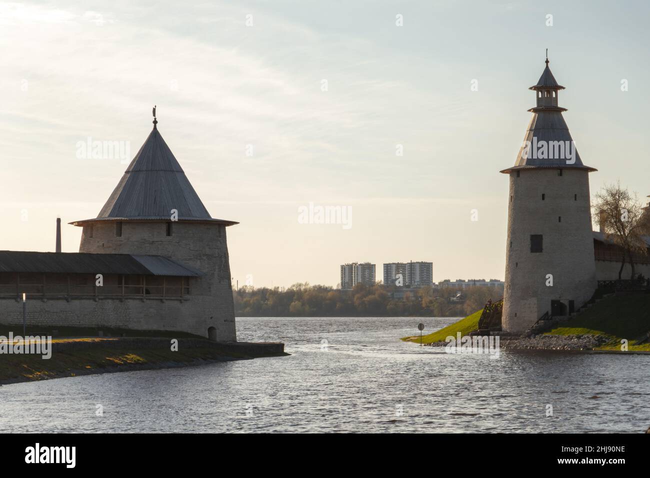 Stone towers at the river coast, Kremlin of Pskov, Russian Federation. Ancient coastal fortification Stock Photo