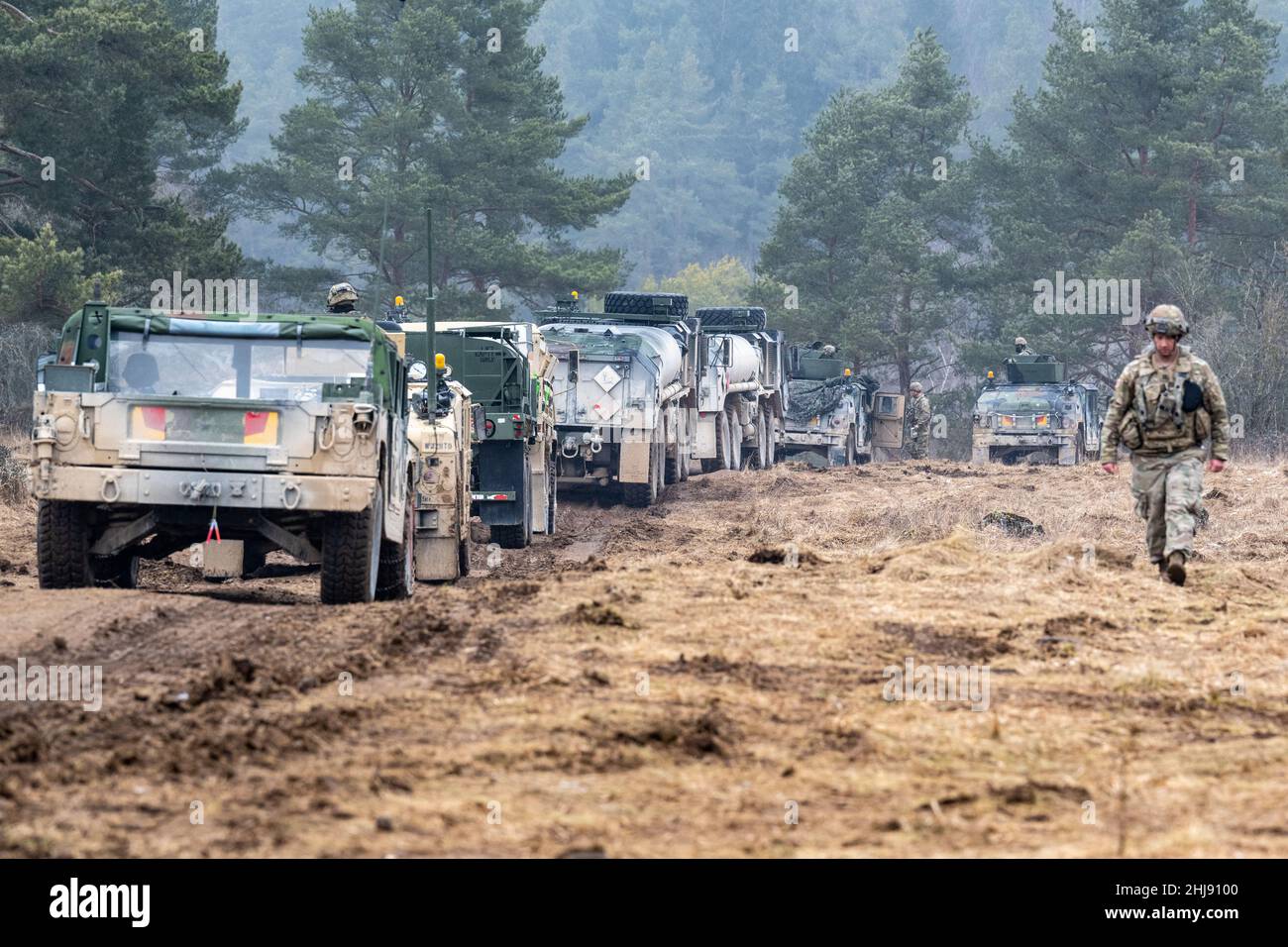 Hohenfels, Germany. 27th Jan, 2022. U.S. military vehicles drive around the Hohenfels military training area during the international military exercise 'Allied Spirit 2022'. With helicopters, tanks and infantry, military forces from more than ten countries are currently training for emergencies at a training area. Credit: Armin Weigel/dpa/Alamy Live News Stock Photo