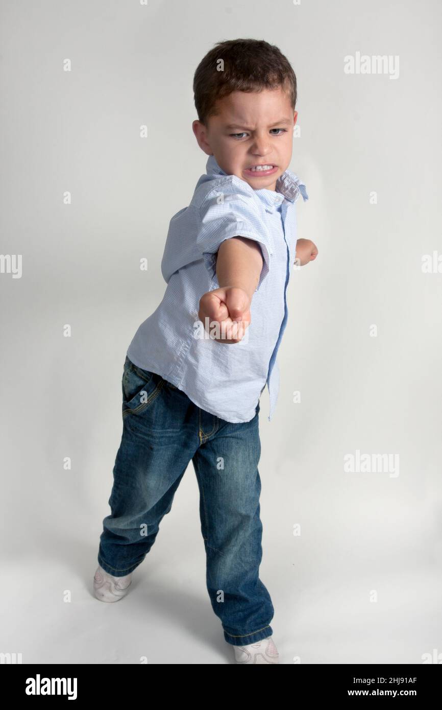 little boy playing aggressively Stock Photo