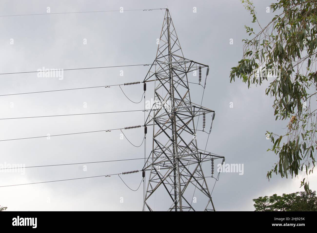 Electricity High voltage Line deliver electricity over long distances. Electric power transmission. Overhead power line. electric power transmission a Stock Photo