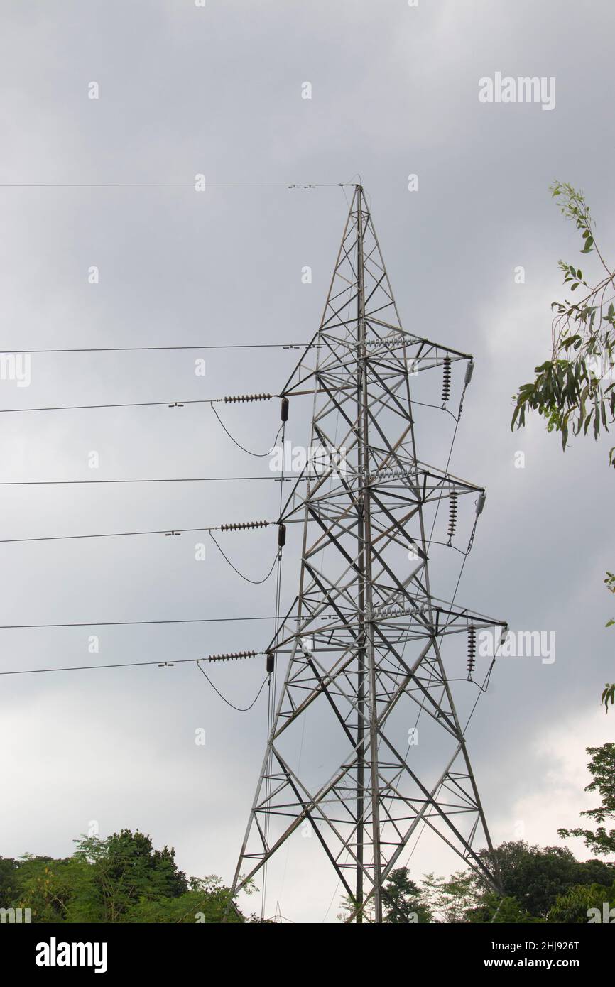 Electricity High voltage Line deliver electricity over long distances. Electric power transmission. Overhead power line. electric power transmission a Stock Photo