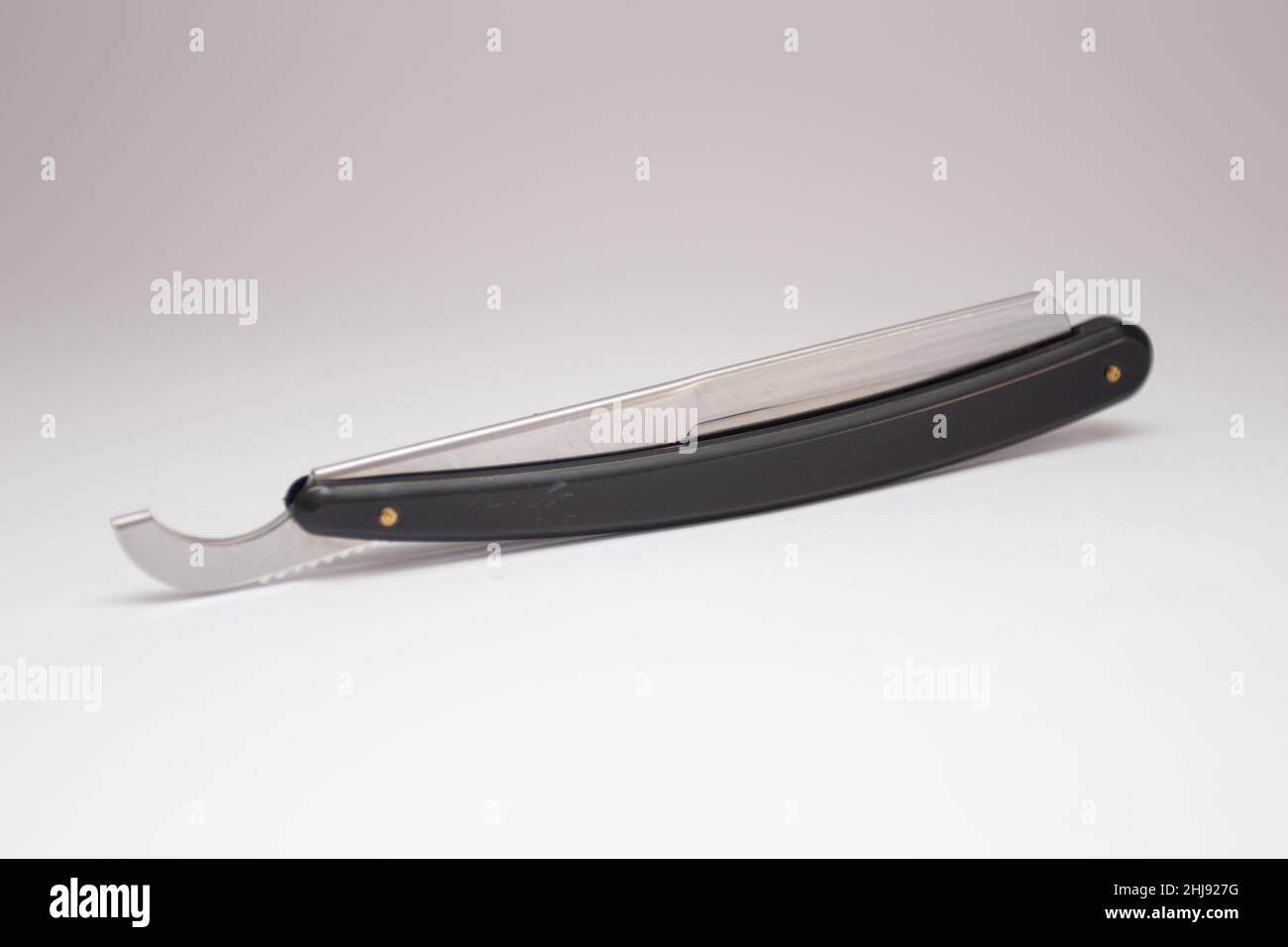 Black straight dangerous razor on a white Stock Photo Alamy