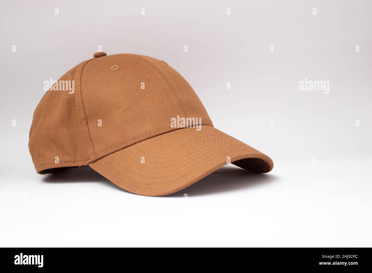 Brown baseball cap on a white background. Stock Photo