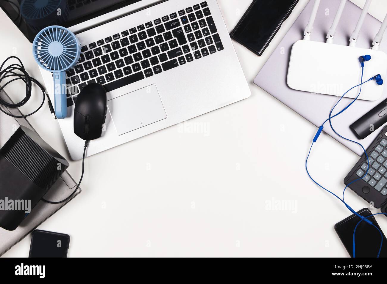 Top view to old laptop computers, digital tablets, mobile phones, many