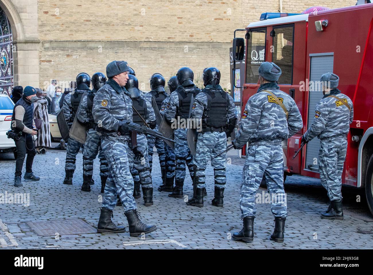 Extras dressed as Russian armed police with guns on the set of new upcoming television miniseries ‘Secret Invasion’ at The Piece Hall, Halifax Stock Photo