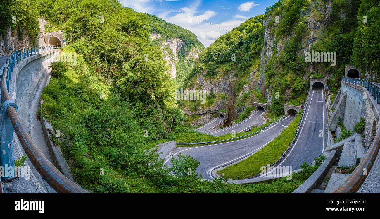 Panoramic view of the winding road leading to Passo San Boldo, connecting the Val Belluna with the Val Mareno. Stock Photo