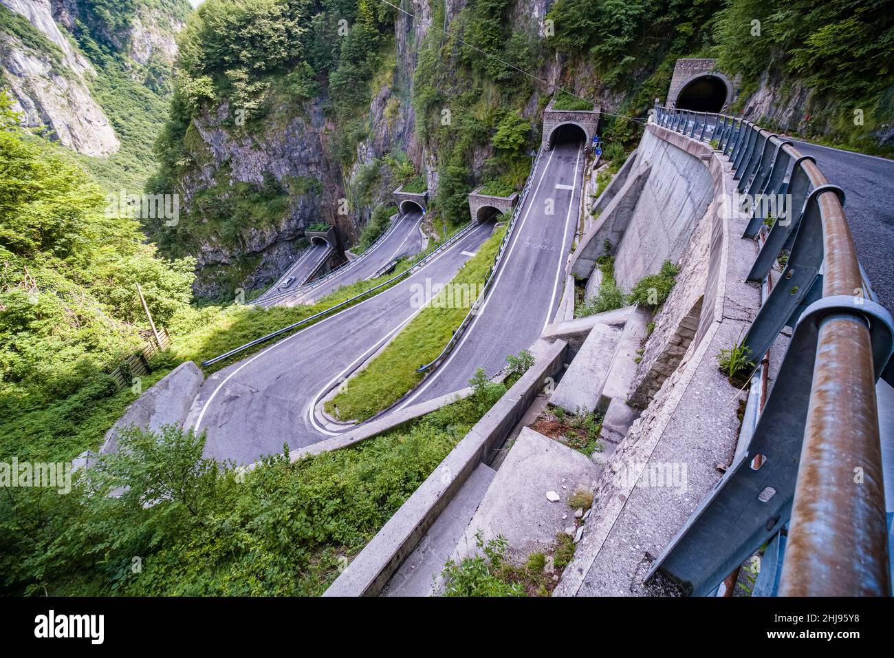 Aerial view of the winding road leading to Passo San Boldo, connecting the Val Belluna with the Val Mareno. Stock Photo