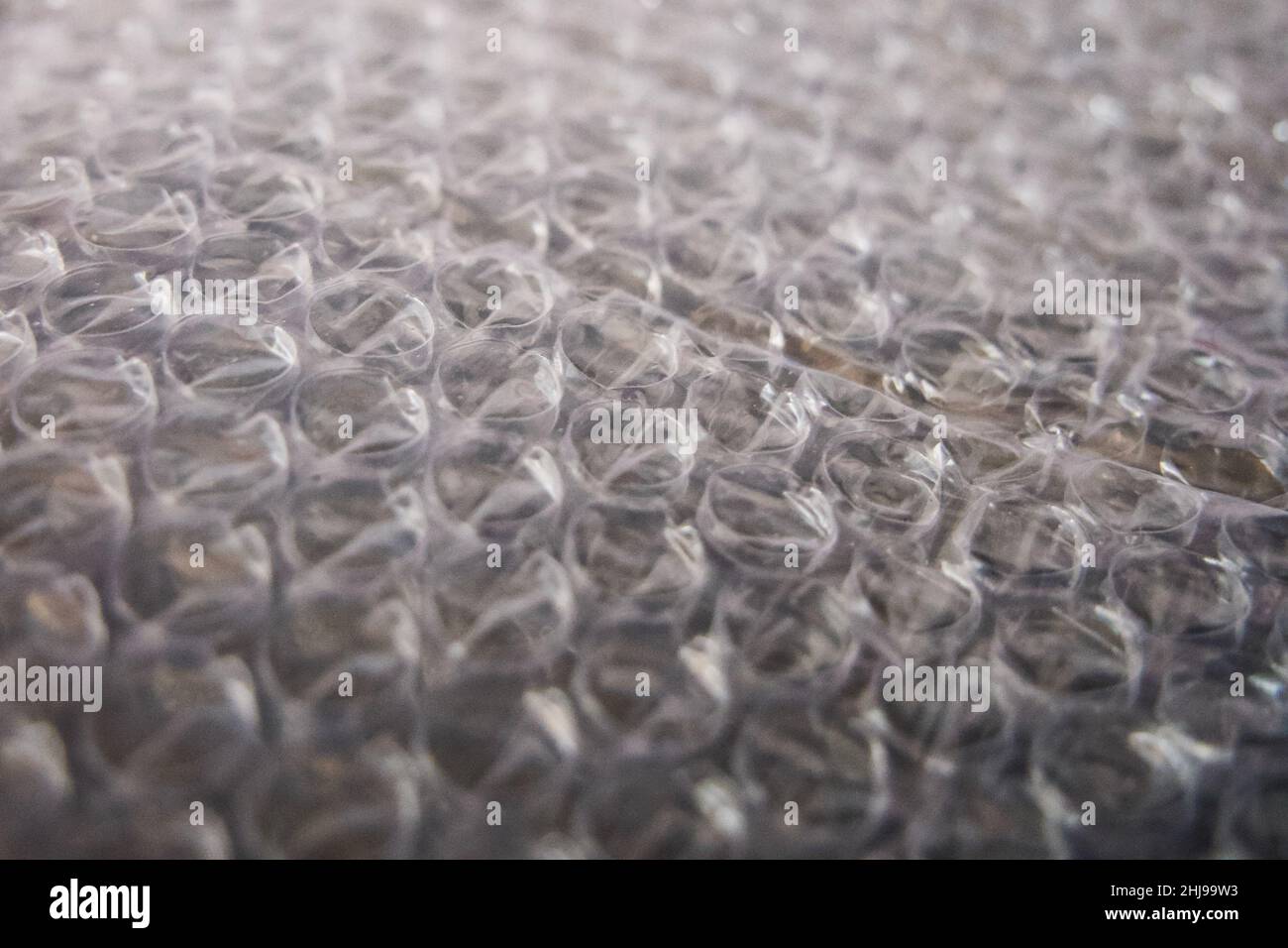 Bubble wrap is a pliable transparent plastic material used for packing