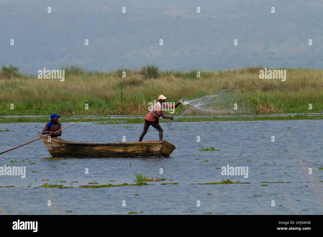 fishermen on the Nile Uganda- little fishing boat on the Nile near ...