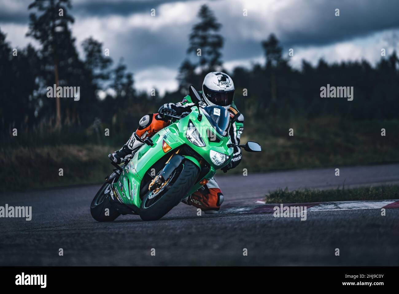 Asphat Motorcycle Racing man riding motorcycle in asphalt road. Motorcyclist at black and white ...