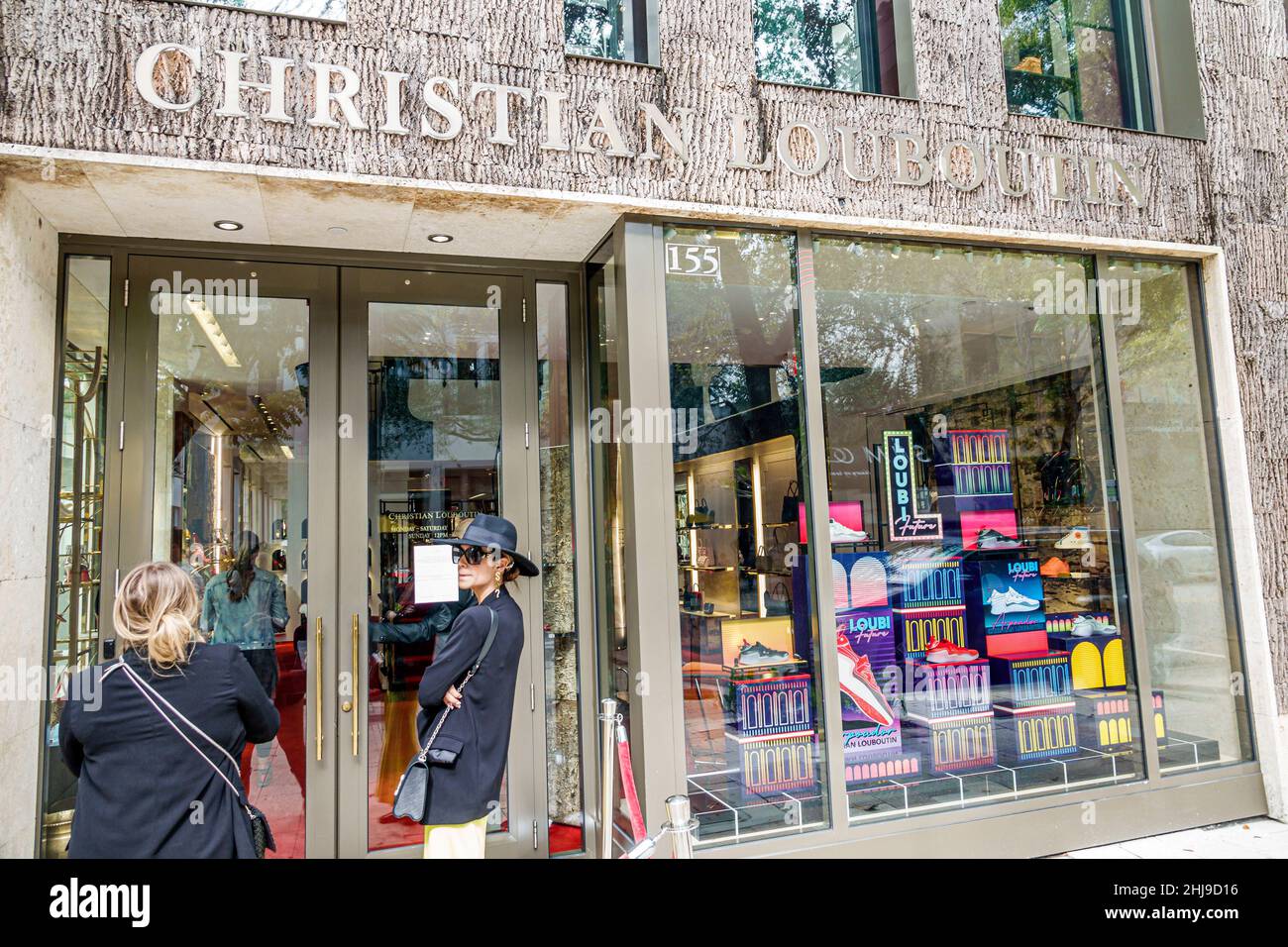 Design district shopping shoppers christian louboutin french luxury