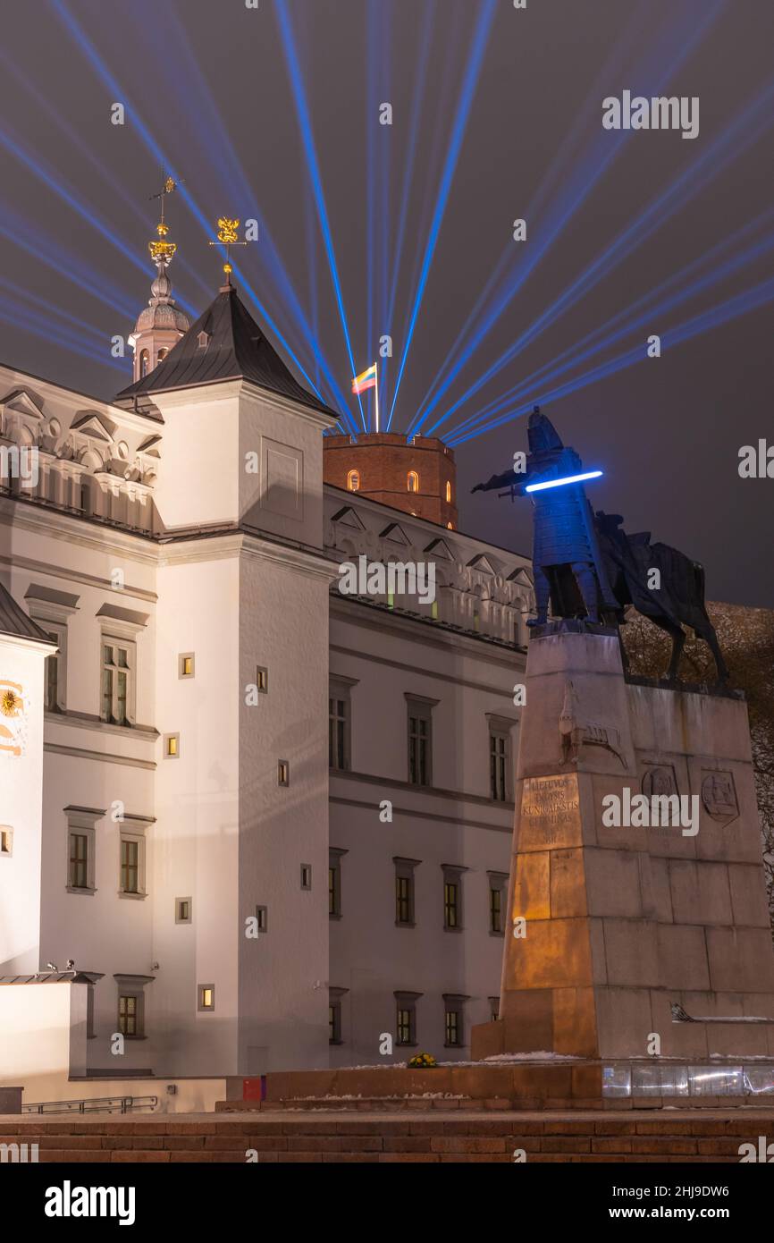 Vilnius Light Festival. Gediminas statue or star wars fighter with sword, at the Cathedral square with palace of the Grand Dukes of Lithuania Stock Photo