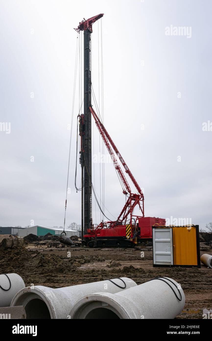 Pile driver on a construction site in the Netherlands Stock Photo