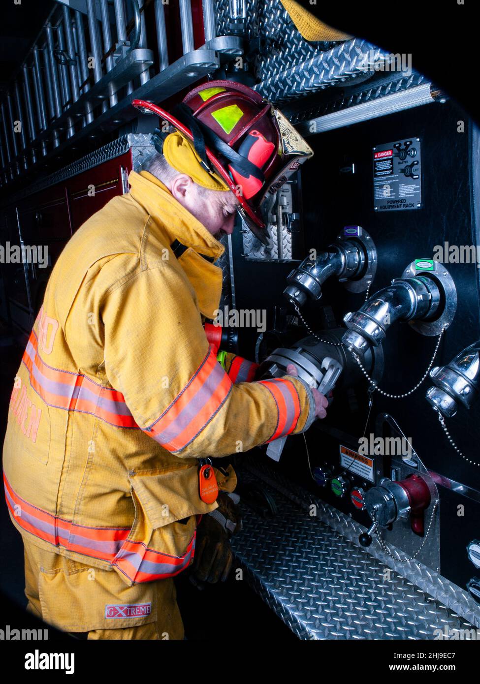 Firefighter in turnout gear Stock Photo