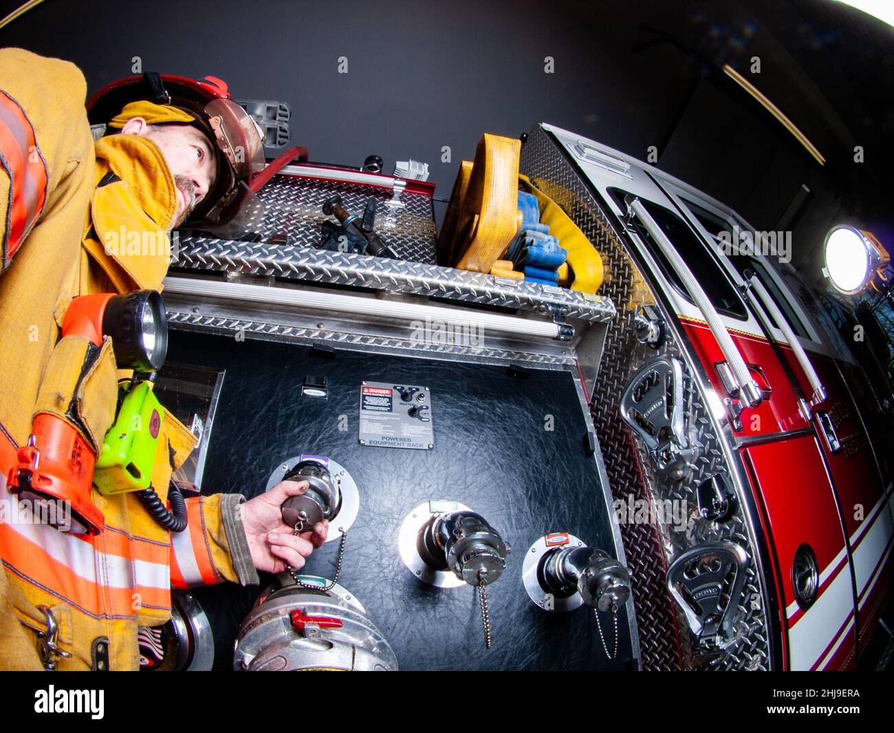 Firefighter in turnout gear Stock Photo