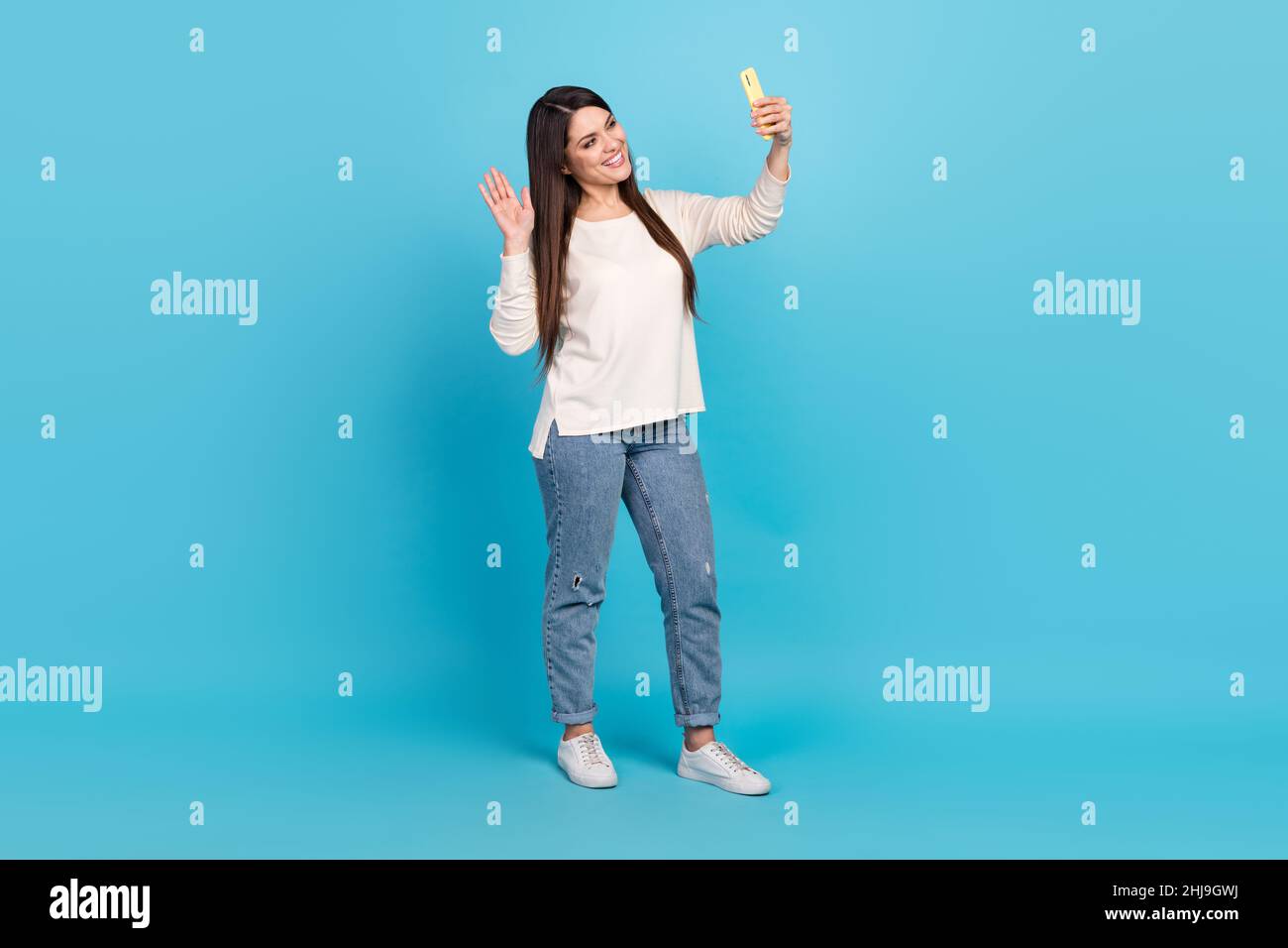 Full body photo of young cheerful lady talk mobile wave greetings ...