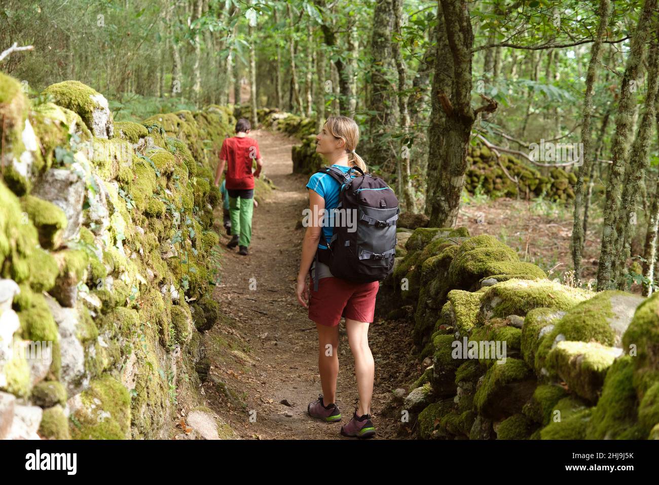 Mature woman hiking on trail hi-res stock photography and images - Alamy