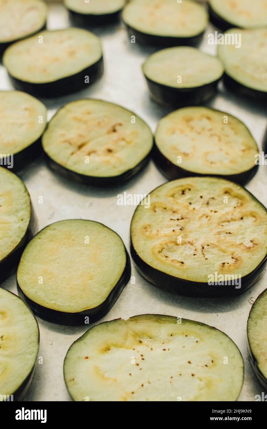 Eggplant, aubergine slices, raw and ready to be baked or fried Stock