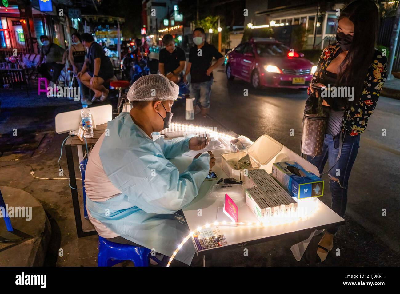 Bangkok, Thailand. 29th Jan, 2022. A medical worker sells ATK swab