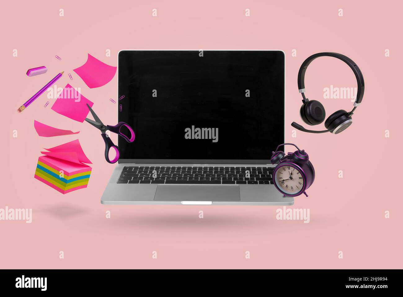 Creative minimal composition made with a laptop, school supplies, headphones and alarm clock flying in the air. Back to school. Online teaching. Minim Stock Photo