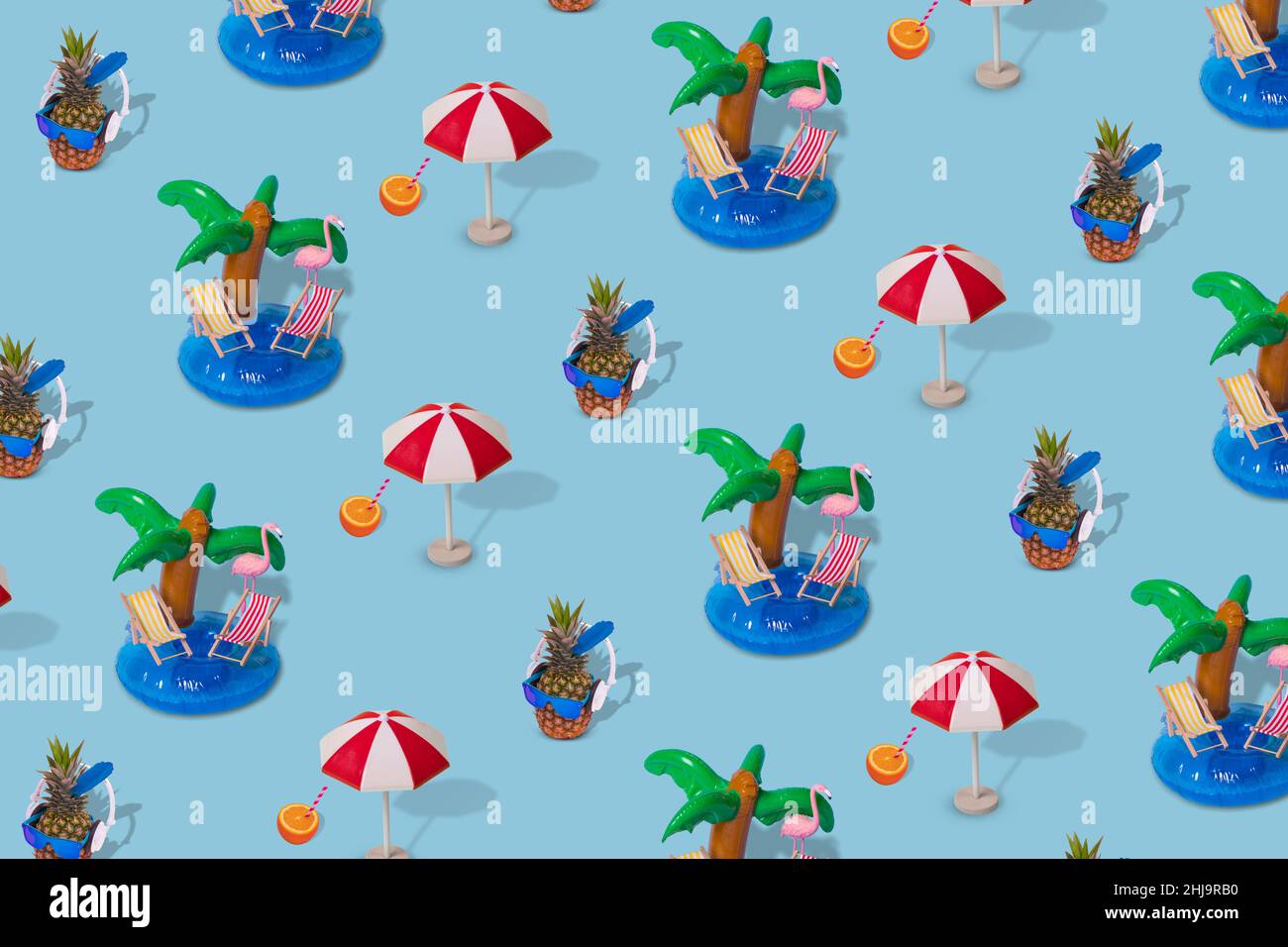 Trendy summer pattern made with various summer things on bright blur background. Minimal summer vacation concept. Stock Photo