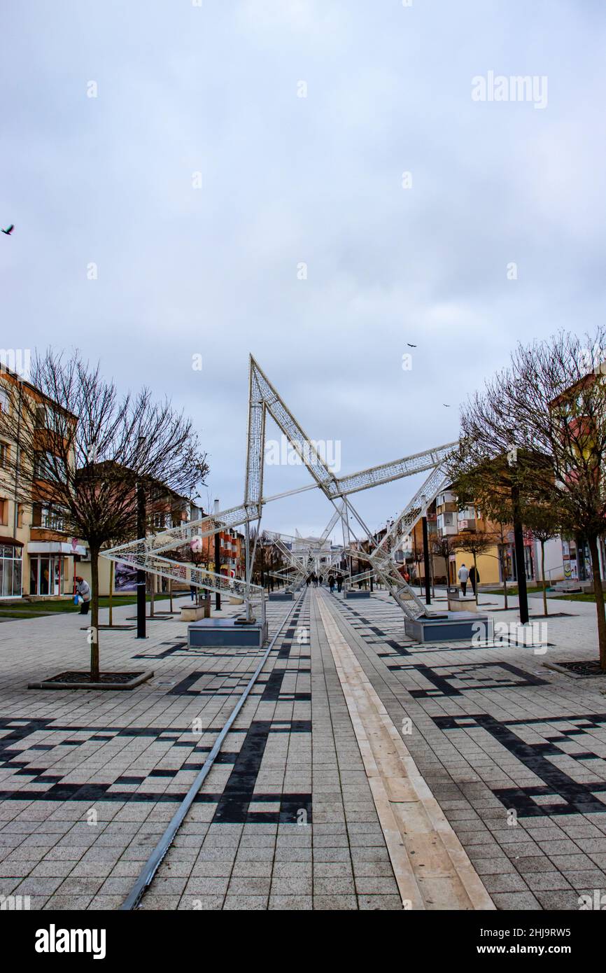 Hunedoara, Romania-January 2, 2022: New Year's photo from downtown Hunedoara showing the pavement decorated for Christmas and people walking relaxed Stock Photo