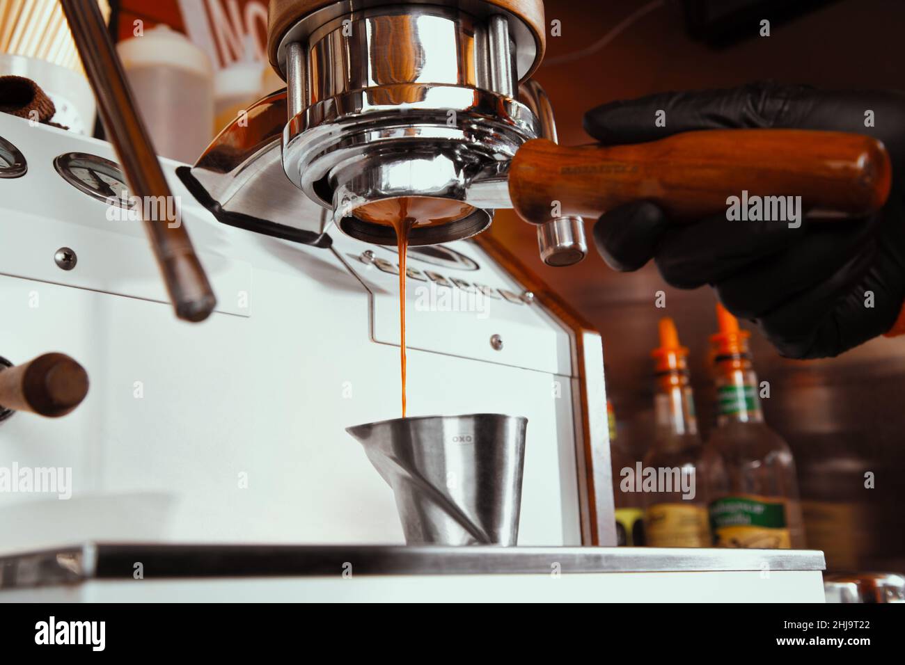 https://c8.alamy.com/comp/2HJ9T22/fresh-morning-coffee-pouring-from-a-vintage-coffeeshop-espresso-machine-2HJ9T22.jpg