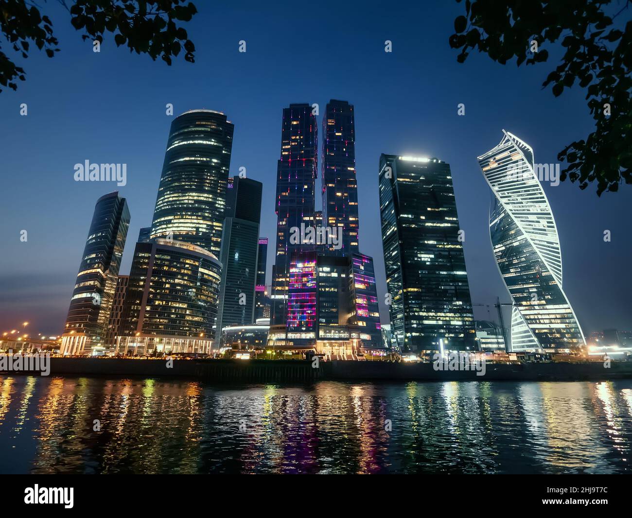 Moscow City skyscrapers at Night with reflection of evening illumination in River. Moscow International Business Center. Stock Photo