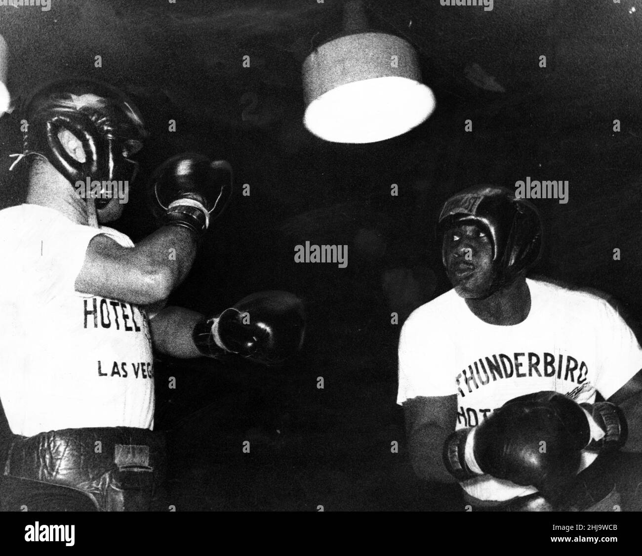 Sonny Liston displays his talents in a three-round work-out with sparring partner Fernando Cox at St James' Hall, Newcastle. 16th September 1963. Stock Photo