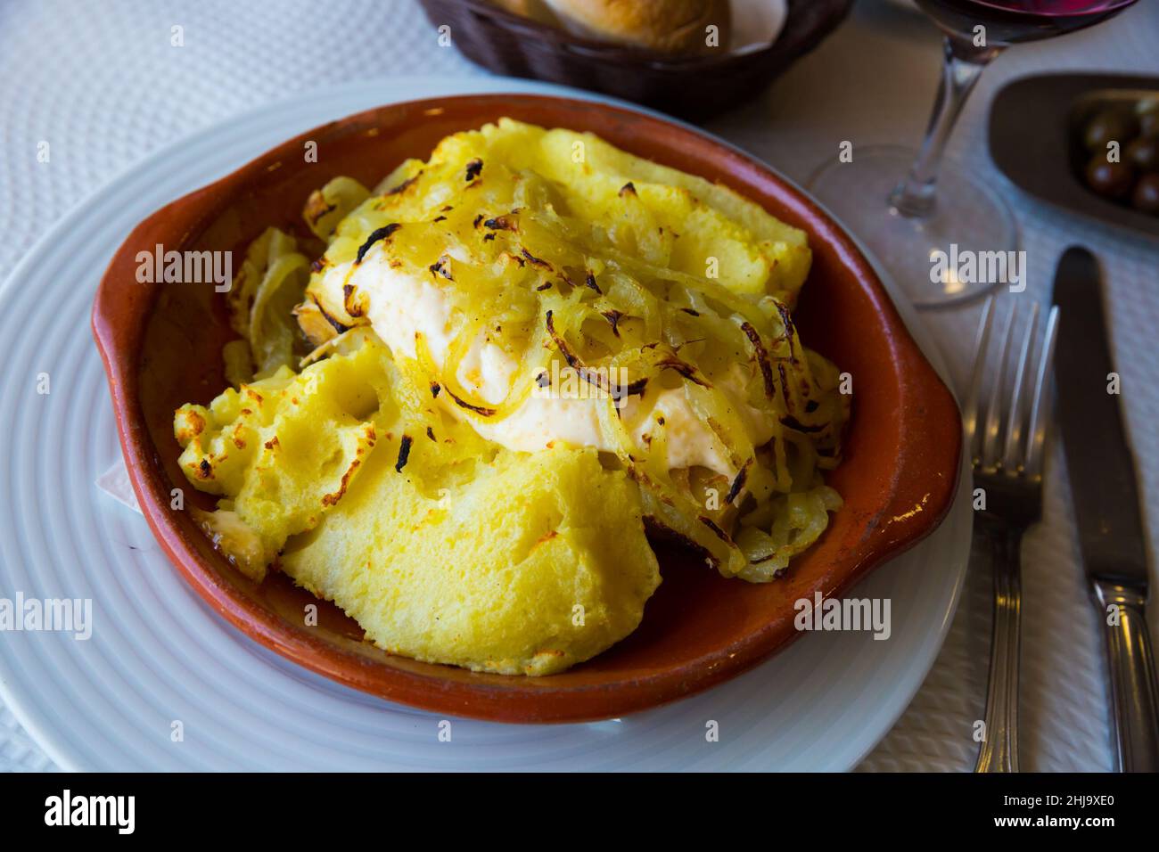Cod fish baked with potatoes Stock Photo - Alamy